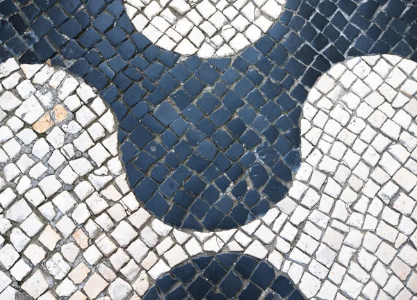 Typical Portuguese black and white stone mosaic "calcada" paveme — Stock Photo, Image