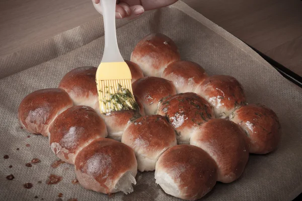 Freshly baked rolls smeared garlic butter and dill — Stock Photo, Image