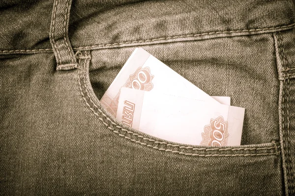 Die Hosentasche mit Geld. Stoffhintergrund. gemildert — Stockfoto