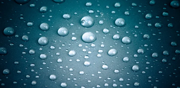 Drops of water on the colored background — Stock Photo, Image