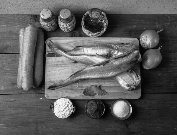 Still life with fish, vegetables and spices on a wooden backgrou — Stock Photo, Image