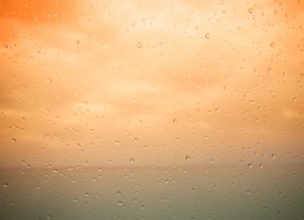 Seaview through the raindrops on window. Toned — Stock Photo, Image