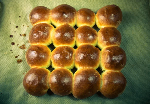 Freshly baked rolls only taken out of the oven. Toned — Stock Photo, Image