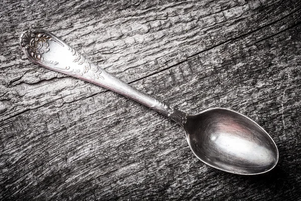 Retro spoon on the old wooden table. Toned — Stock Photo, Image