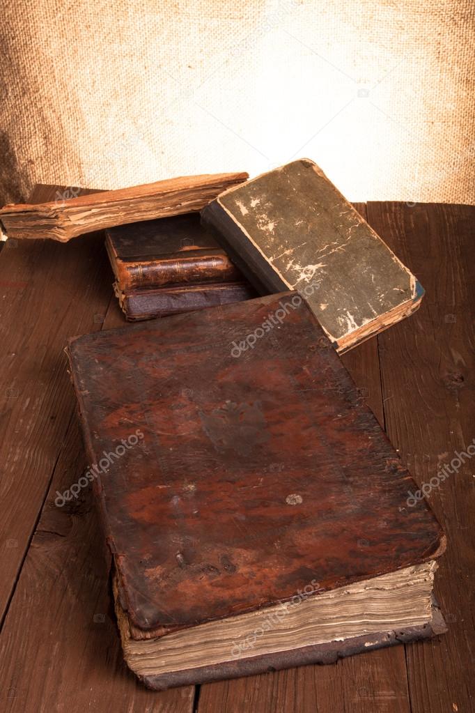 old books on a wooden table