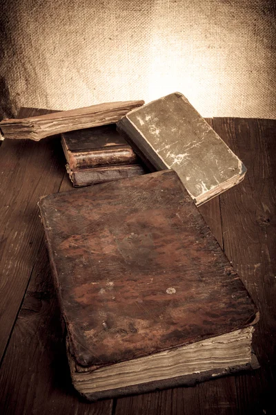 Old books on a wooden table — Stock Photo, Image