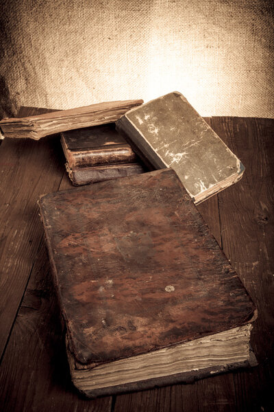 old books on a wooden table