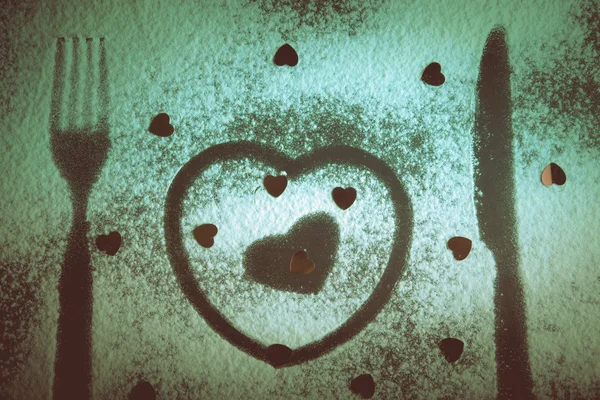 Çatal, bıçak ve un üzerinde siyah bir ba kalpler siluetleri — Stok fotoğraf