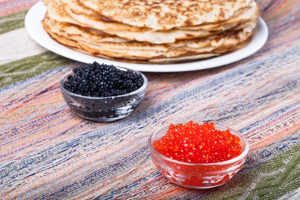 Russian pancakes - blini with red and black caviar — Stock Photo, Image