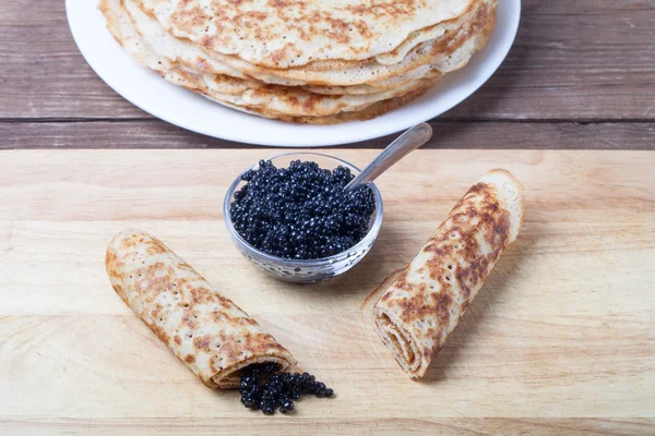 Russian pancakes - blini with black caviar — Stock Photo, Image