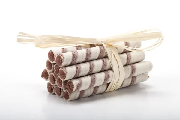Waffle tubes with chocolate cream on white background — Stock Photo, Image