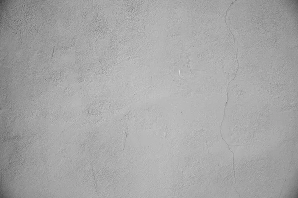 Mur plâtré avec fissure verticale. Contexte. Gris tonique — Photo