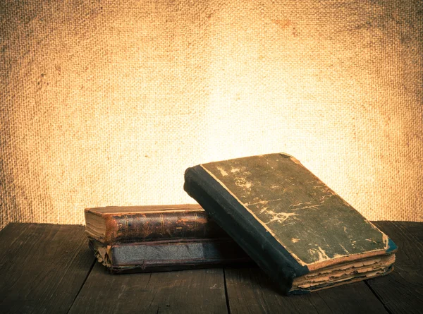 Antique book lying on an old wooden table — Stock Photo, Image