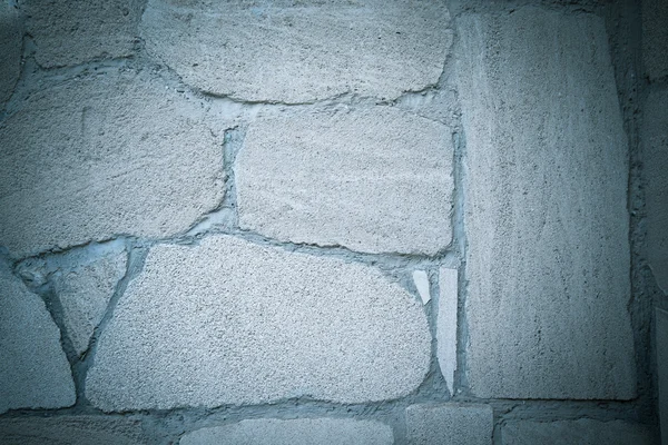 Beige wall of natural stones. Background. Toned — Stock Photo, Image