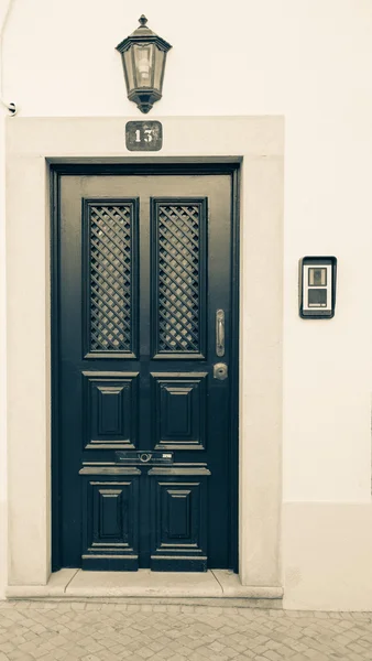 Beautiful entrance door, a lantern and a number 13 on the light — Stock Photo, Image