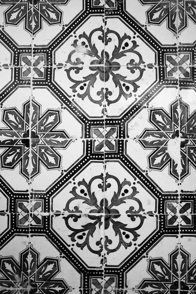 Old ceramic tile with black-and-white pattern