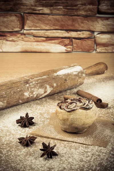 Homemade pastries on a light wooden table with flour. Toned — Stock Photo, Image