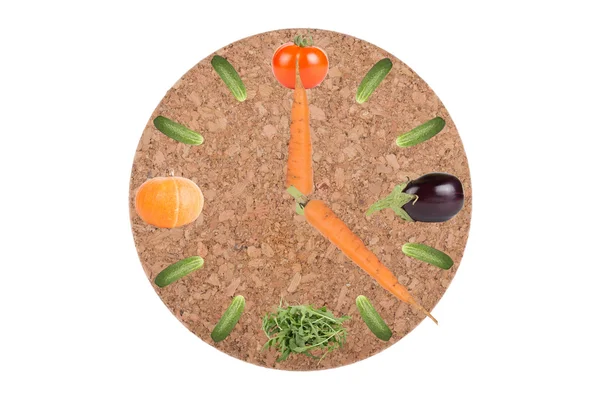 Clock of vegetables on a stand under the hot and with arrows of — Stock Photo, Image