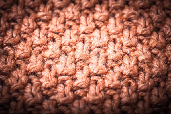 Handmade orange knitting wool pattern background. Toned — Stock Photo, Image