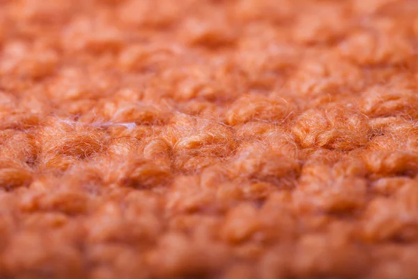 Macro view to Handmade orange knitting wool pattern background — Stock Photo, Image