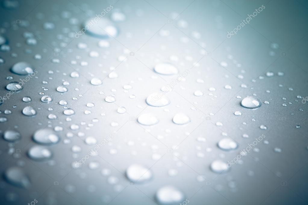 Drops of water on a color background. Toned gray. Shallow depth 
