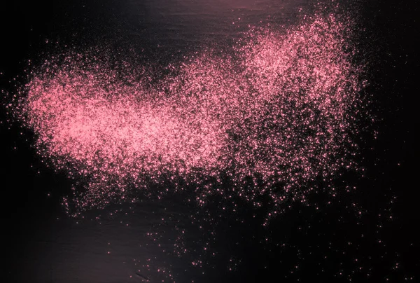 Flour spilling on black background. Toned pink. Culinary galaxy — Stockfoto