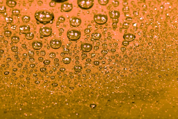 Drops of water on a color background. Orange. Shallow depth of f — Stock Photo, Image