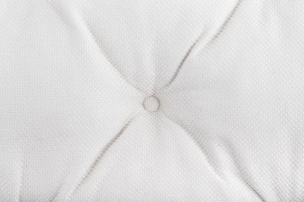 Texture of light fabric with pleats and buttons. Background. — Stock Photo, Image