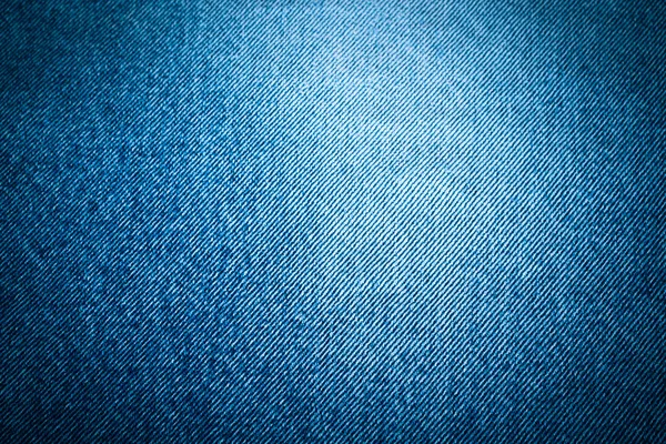 De Jeans textuur voor achtergrond. Afgezwakt — Stockfoto