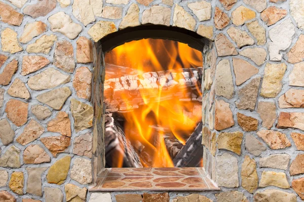 The reflection of the real fire in a mirror decorative stone fir — Stock Photo, Image