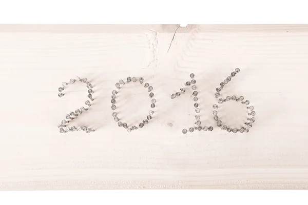 The number 2016 of nails on a light wooden background. Christmas — Stock Photo, Image