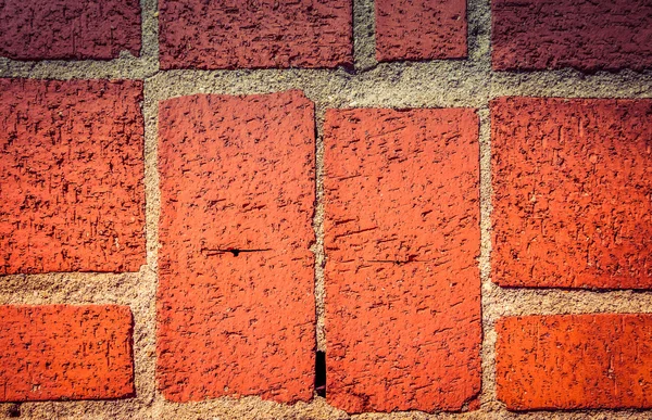 Fragment of red brick wall for background. Toned — Stock Photo, Image