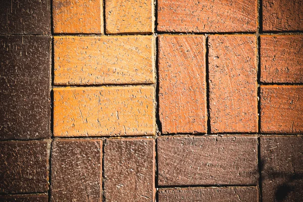 Fragment of red brick wall for background. Toned — Stock Photo, Image