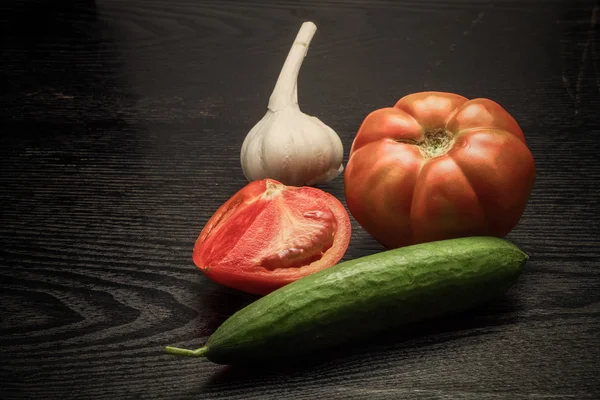 Fresh ripe vegetables on a black table or board like background. — Stock Photo, Image