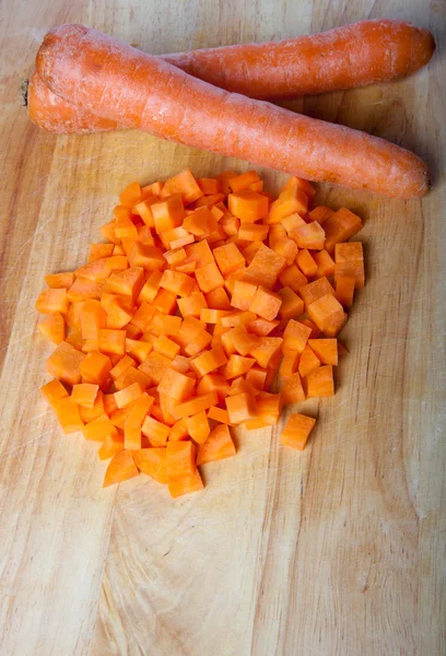 Fresh carrot on a light wooden table — Stock Photo, Image