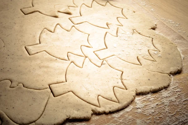 Dough for gingerbread cookie and cookie cutted in different shap — 스톡 사진