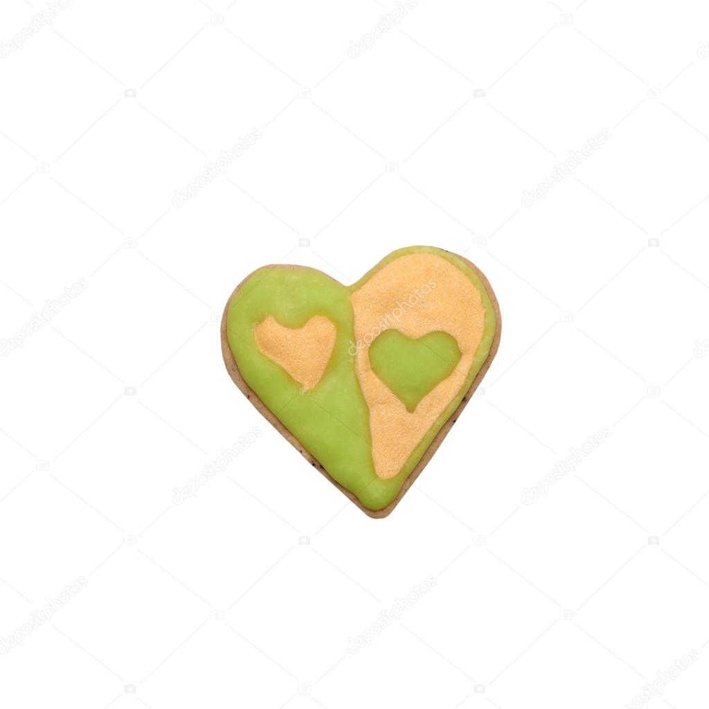 Homemade gingerbread cookie with colored frosting isolated on a 
