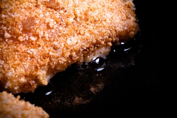 Chicken cordon bleu fried in oil in a frying pan. Selective focu — Stock Photo, Image