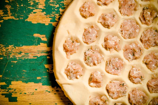 Pelmeni - Russian ravioli. Cooking process. Selective focus. Ton — Stock Photo, Image