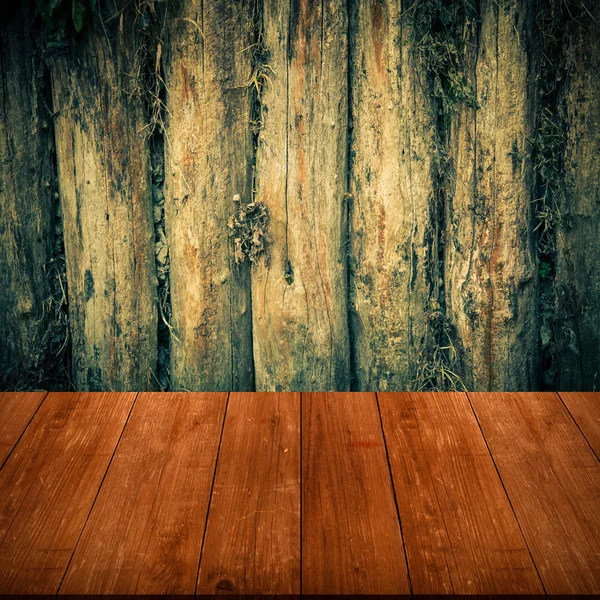 The wall of the old logs. Background. View from dark wooden gang — Stock Photo, Image