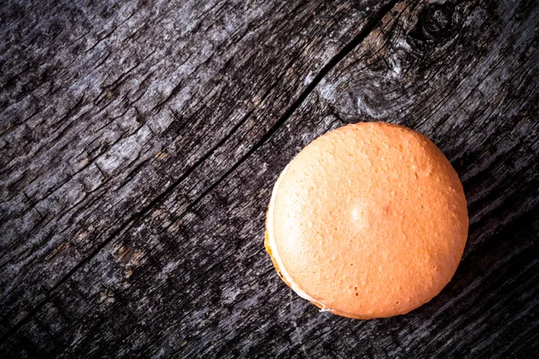 Macaroons on a old grey wooden background. Toned — Stock Photo, Image