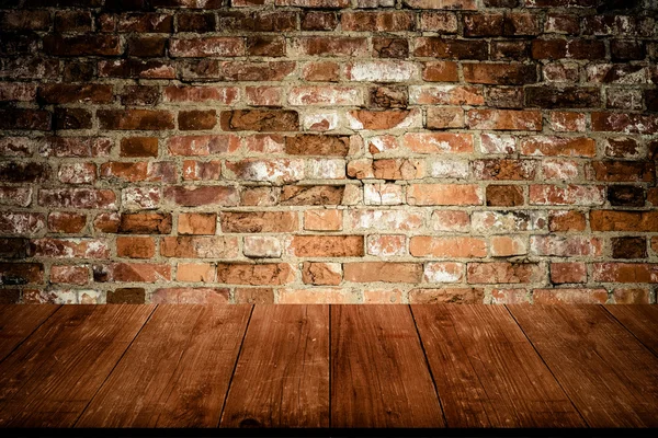 Wall of old red bricks. Background. View from dark wooden gangwa — Stock Photo, Image