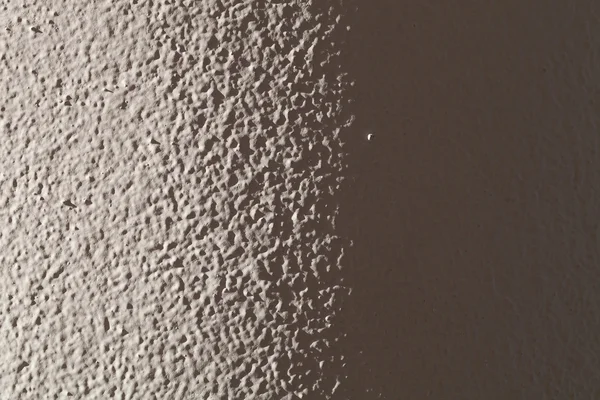 Light plastered wall for background. Light from left side. Close — Stock Photo, Image