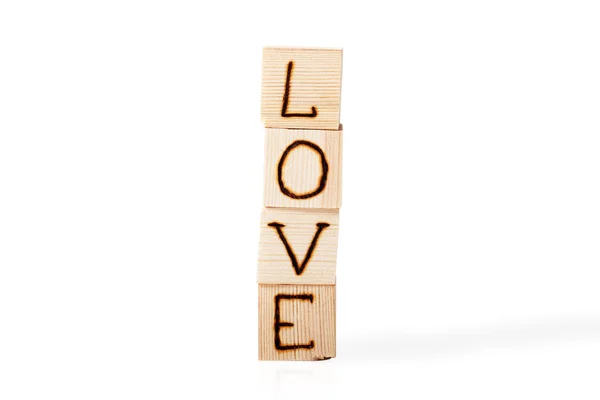 Romantische inscriptie van letters op lichte houten kubussen geïsoleerde o — Stockfoto