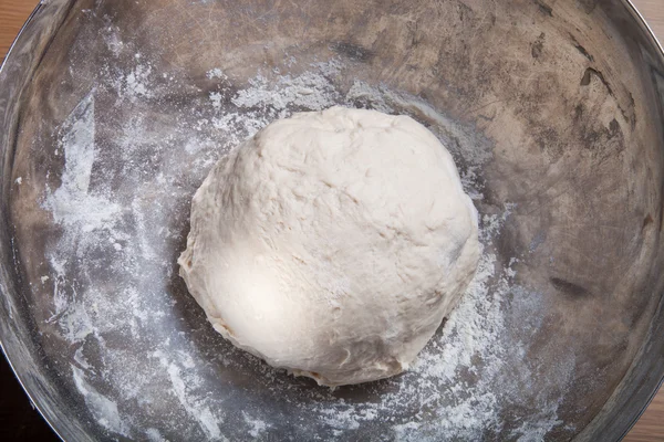 Raw dough in a metal bowl — Stock Photo, Image