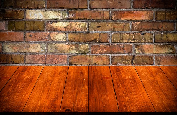 Red brick wall texture. Background. View from dark wooden gangwa — Stock Photo, Image