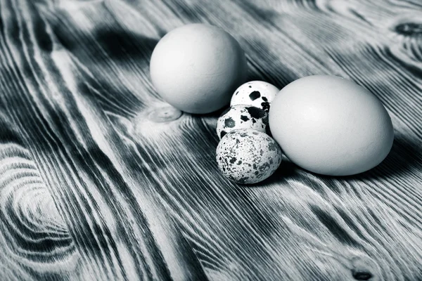 Eggs on new wooden board. Selective focus. Toned — Stock Photo, Image