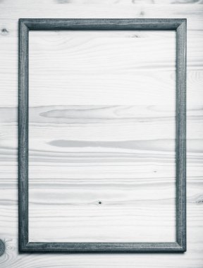 New wooden texture with photo frame for background. Toned