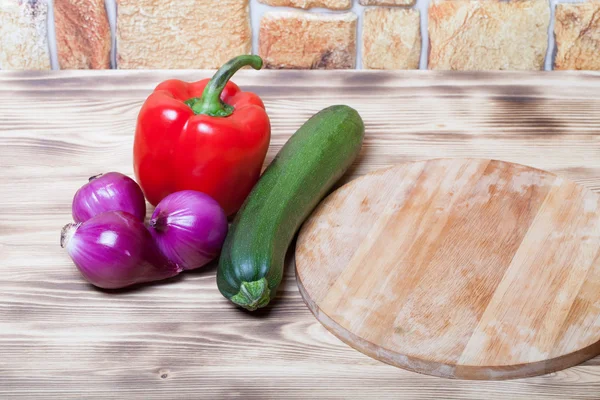 Set of vegetables on light wooden burned background — Stock Photo, Image