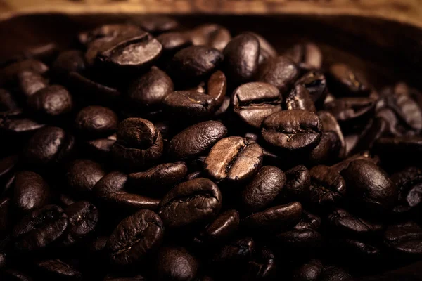 Different kinds of coffee on wooden plate. Selective focus. Tone